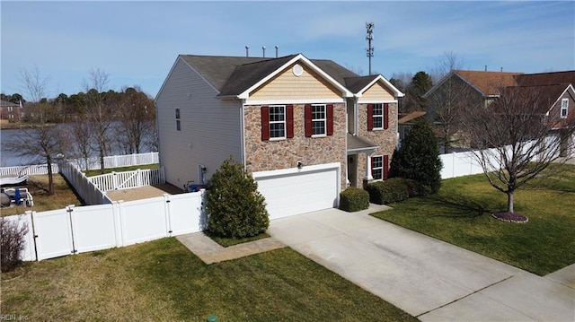 view of front of home featuring a gate, driveway, a fenced backyard, a front lawn, and stone siding