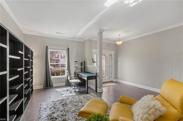 home office with decorative columns, baseboards, and ornamental molding