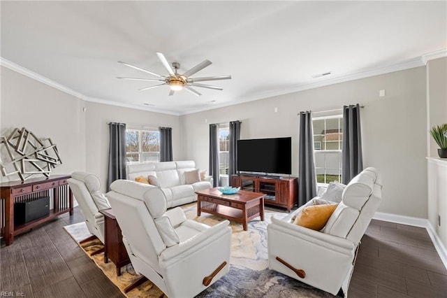 living area with visible vents, baseboards, ornamental molding, wood finished floors, and a ceiling fan