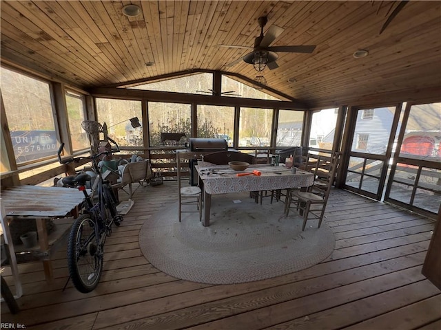 sunroom featuring lofted ceiling, wood ceiling, and a ceiling fan