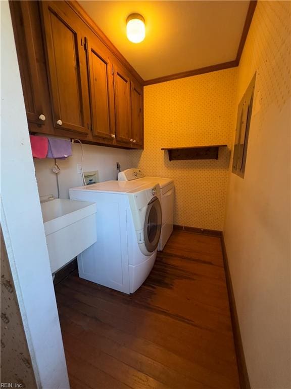 laundry area featuring washer and dryer, cabinet space, crown molding, wallpapered walls, and dark wood-style flooring