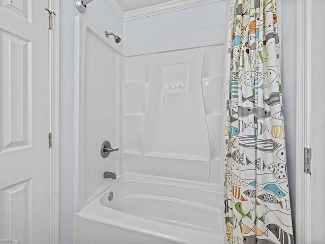 full bathroom with shower / tub combo with curtain and ornamental molding