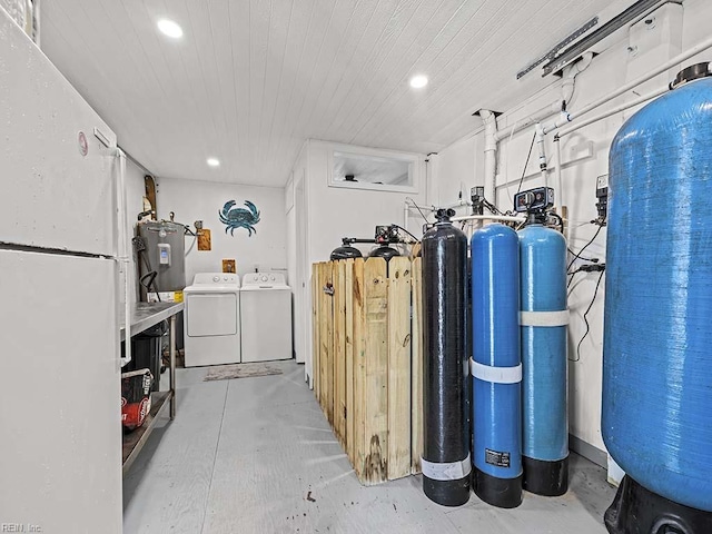 utility room featuring independent washer and dryer and water heater