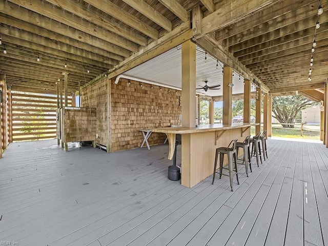 deck featuring a ceiling fan and outdoor dry bar