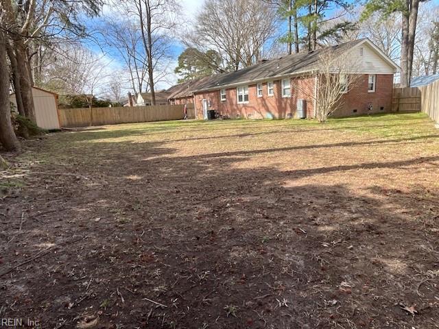 view of yard with a fenced backyard