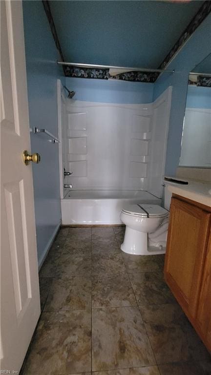 bathroom with vanity, toilet, and shower / bathtub combination