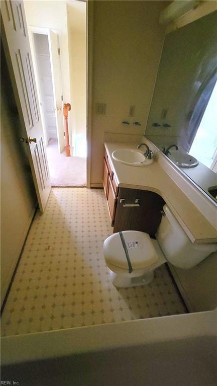 bathroom with tile patterned floors, toilet, and vanity