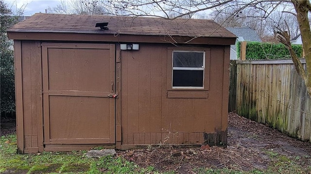 view of shed with fence