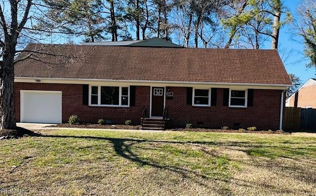 view of front of property featuring brick siding, a shingled roof, a front lawn, crawl space, and an attached garage