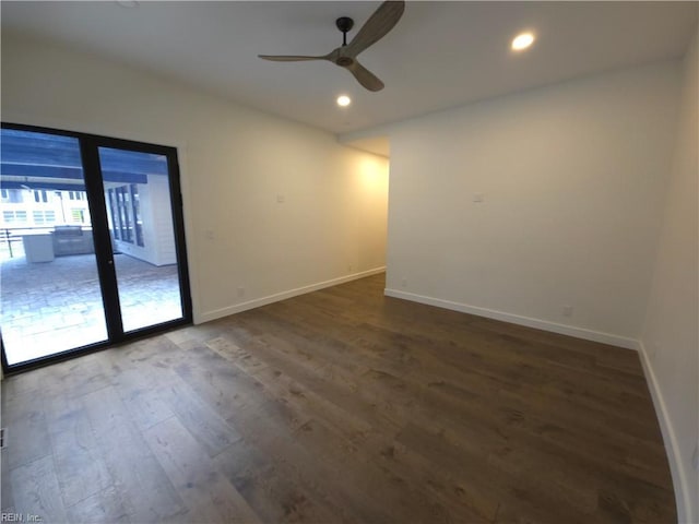 spare room with a ceiling fan, recessed lighting, wood finished floors, and baseboards