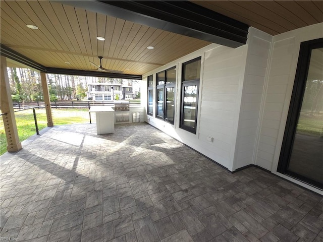 view of patio / terrace with a grill and a ceiling fan