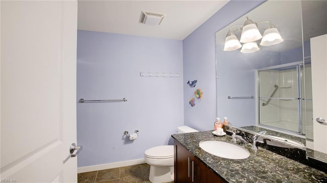 full bathroom with vanity, a shower with shower door, baseboards, visible vents, and toilet