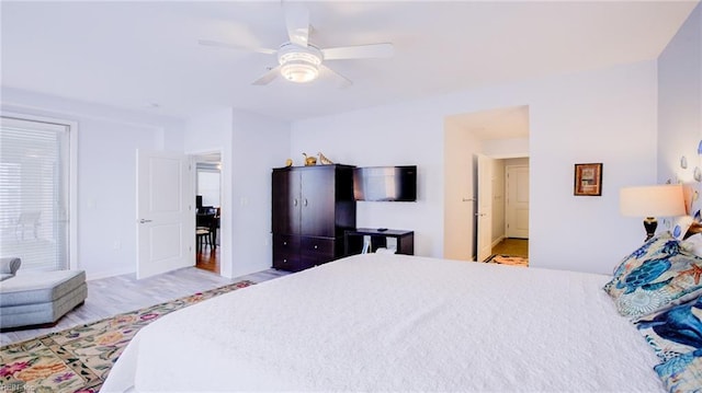 bedroom featuring wood finished floors and a ceiling fan