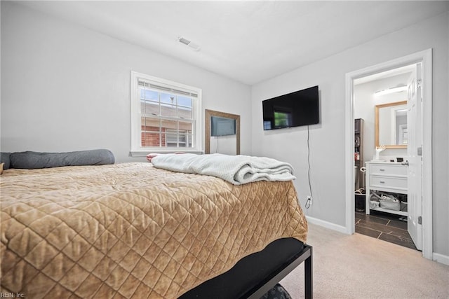 carpeted bedroom with baseboards