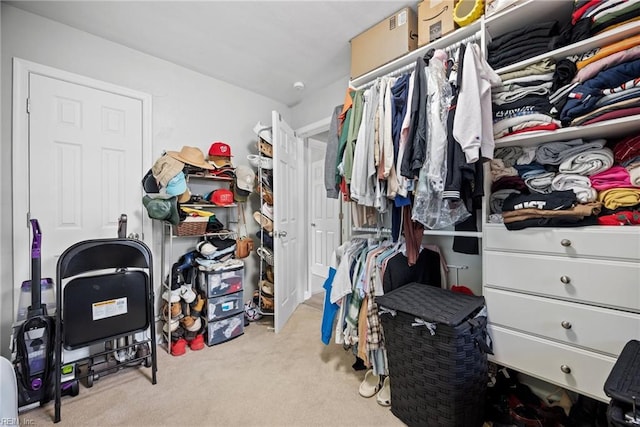 spacious closet with carpet flooring