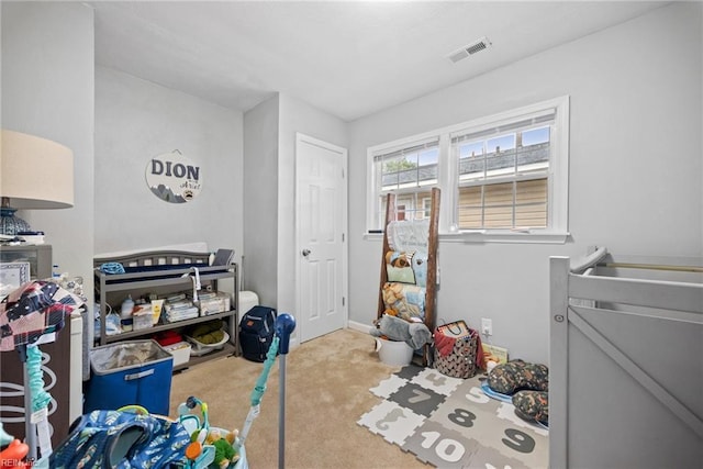 carpeted bedroom with visible vents