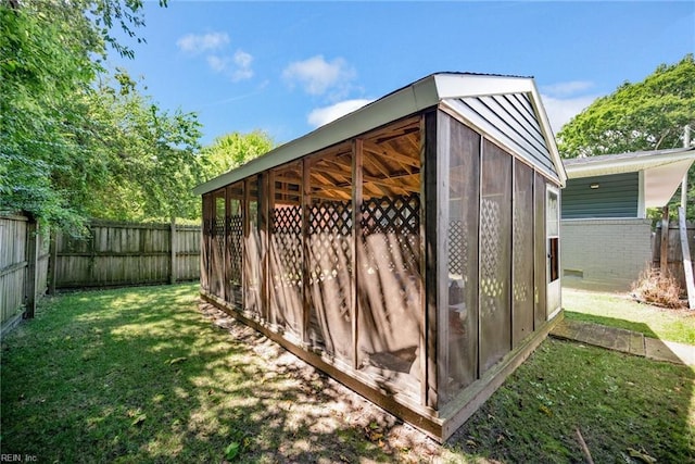 view of outbuilding with an outdoor structure and a fenced backyard