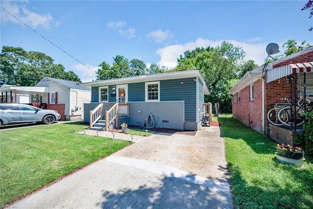 bungalow-style home featuring a front lawn, brick siding, and crawl space