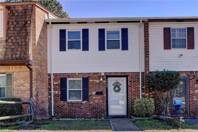 multi unit property featuring brick siding