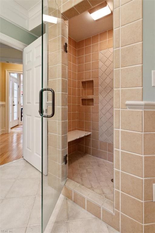 full bathroom featuring a shower stall and tile patterned floors