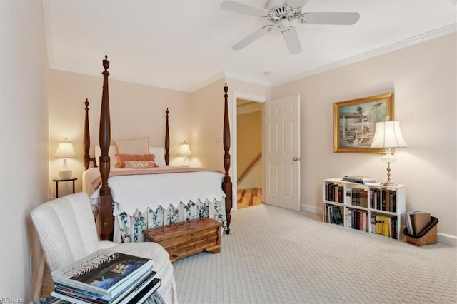 bedroom with ornamental molding, baseboards, and carpet floors