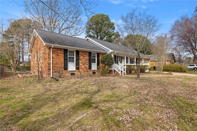 ranch-style house featuring brick siding, crawl space, roof with shingles, and fence