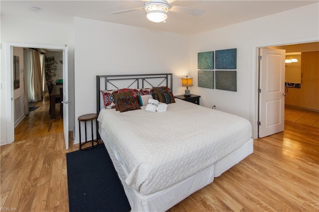 bedroom with light wood-style flooring and a ceiling fan