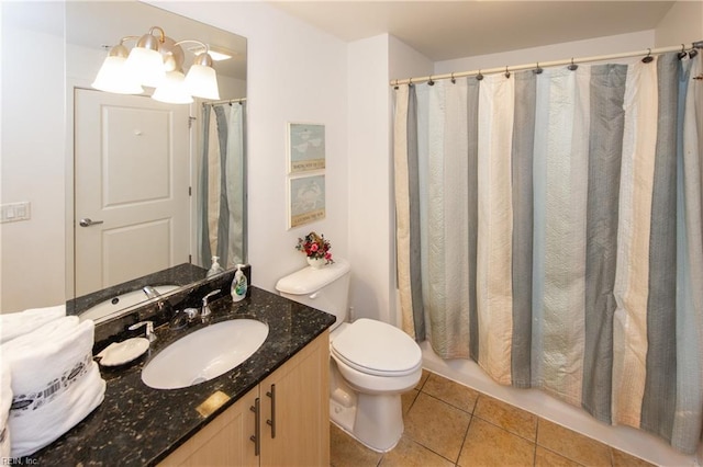 bathroom featuring vanity, tile patterned floors, toilet, and a shower with shower curtain