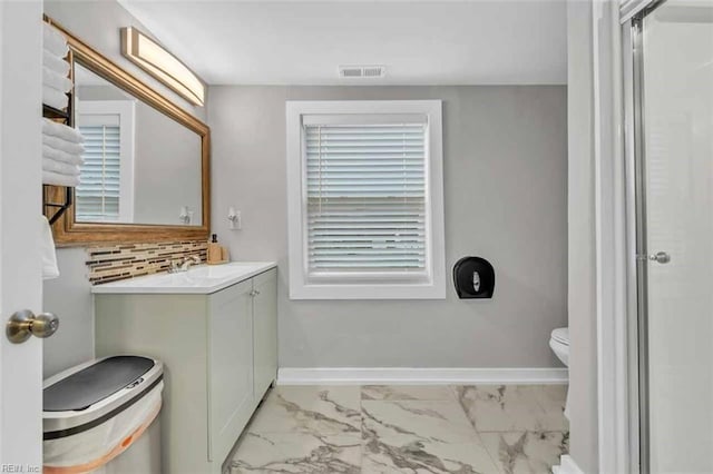 bathroom with visible vents, toilet, marble finish floor, tasteful backsplash, and baseboards