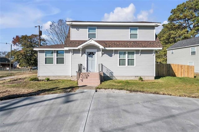 view of front of property with crawl space, a shingled roof, a front lawn, and fence