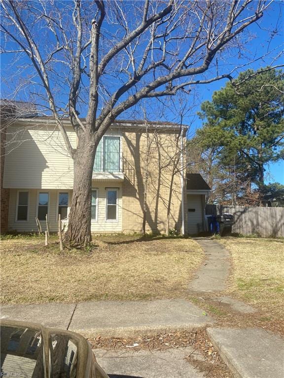 rear view of house with fence