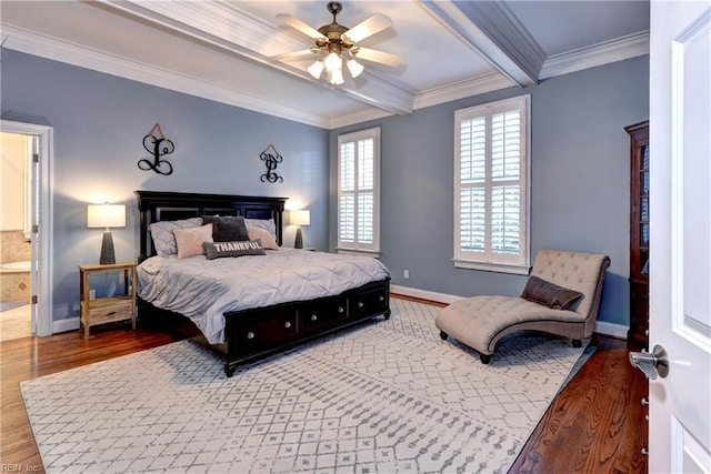 bedroom featuring beamed ceiling, ornamental molding, wood finished floors, baseboards, and ceiling fan