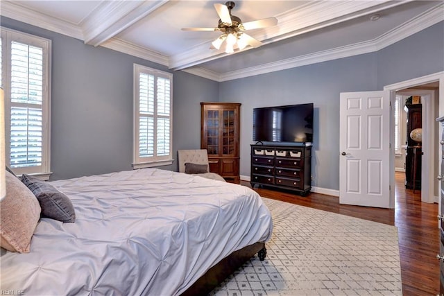 bedroom featuring beamed ceiling, multiple windows, wood finished floors, and ornamental molding