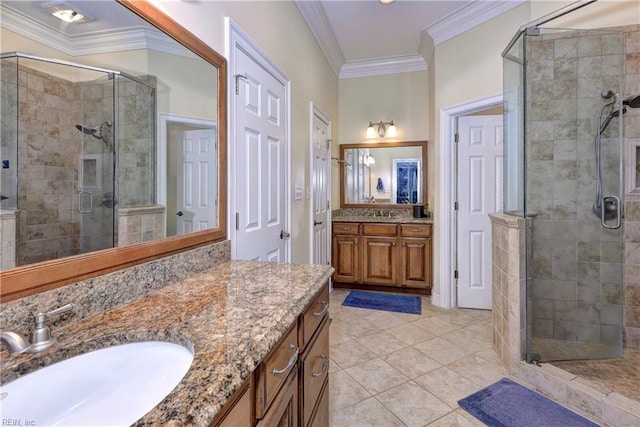 full bathroom with tile patterned floors, a shower stall, vanity, and ornamental molding