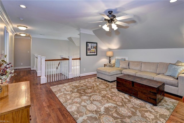 living area with lofted ceiling, ornamental molding, wood finished floors, baseboards, and ceiling fan