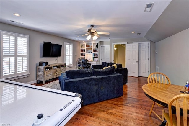 game room featuring recessed lighting, visible vents, built in shelves, and wood finished floors