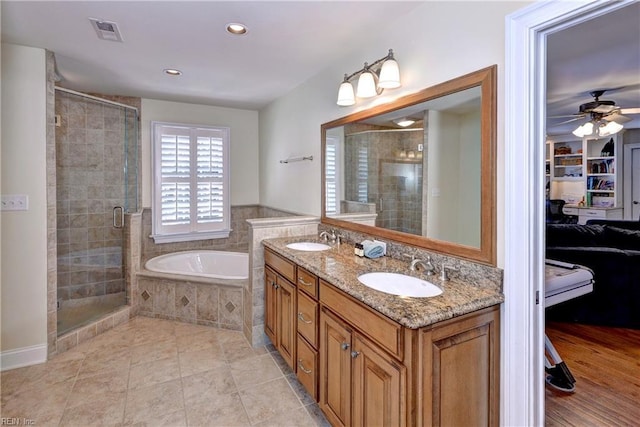 bathroom featuring a sink, visible vents, and a stall shower