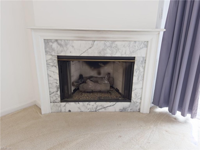 interior details with baseboards, carpet floors, and a fireplace