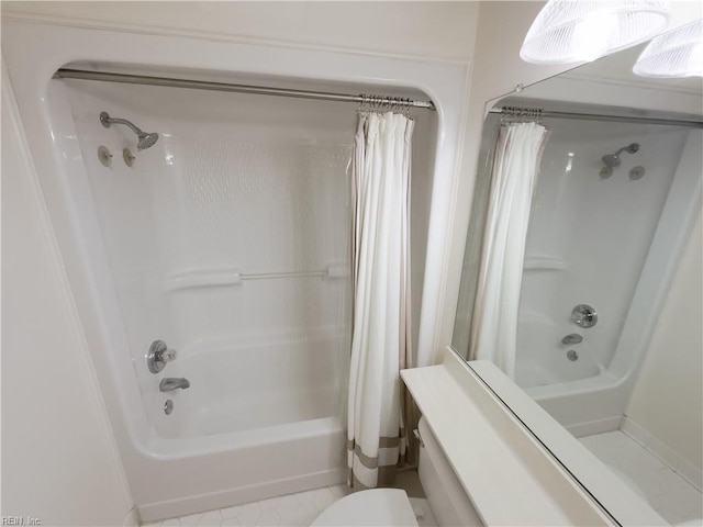 full bathroom featuring tile patterned floors, toilet, and shower / bath combination with curtain