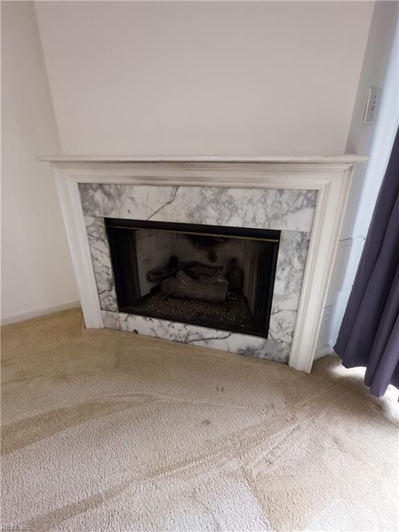 interior details with a fireplace and carpet floors