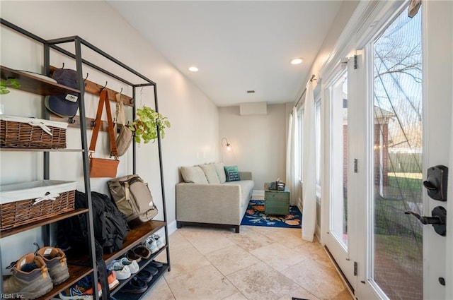 interior space featuring recessed lighting and baseboards