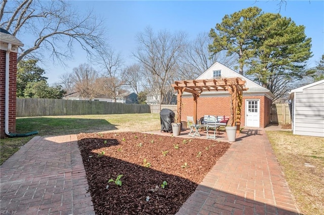 view of yard featuring a patio, an outbuilding, a fenced backyard, and a pergola