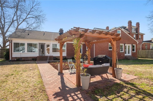 rear view of property with a lawn, a pergola, entry steps, a patio, and fence