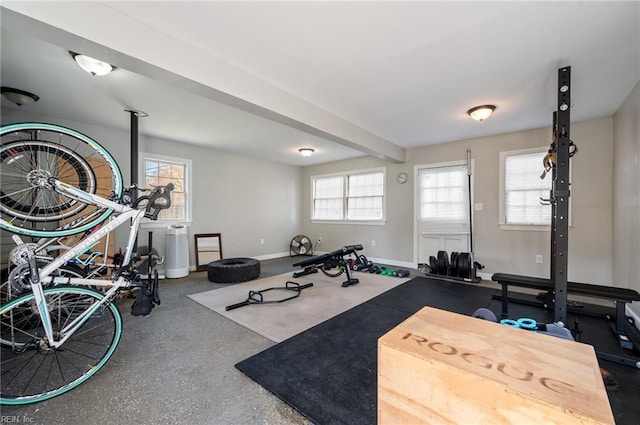 exercise room with baseboards