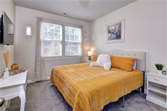 bedroom featuring baseboards, visible vents, and carpet floors