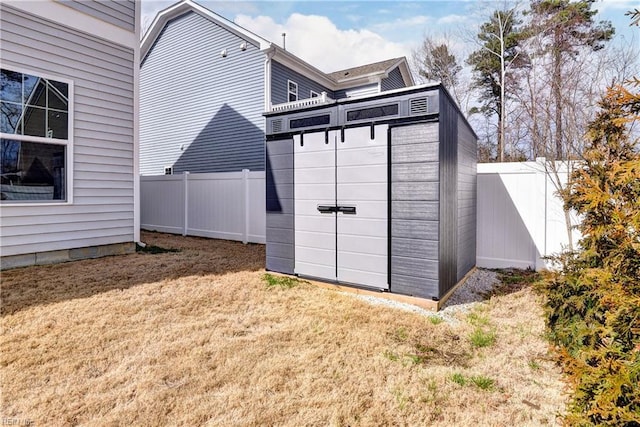 view of shed featuring a fenced backyard