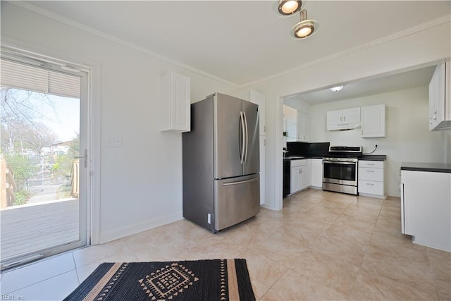 kitchen with a sink, dark countertops, stainless steel appliances, white cabinets, and crown molding