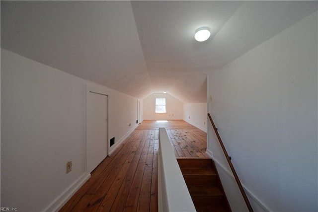 bonus room with visible vents, wood-type flooring, and lofted ceiling