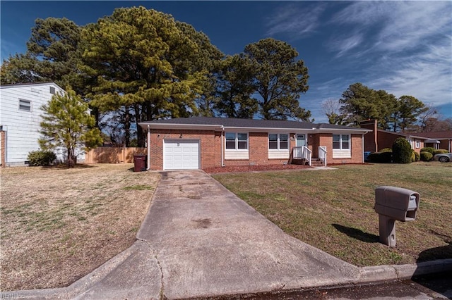 ranch-style home with brick siding, a garage, concrete driveway, and a front yard