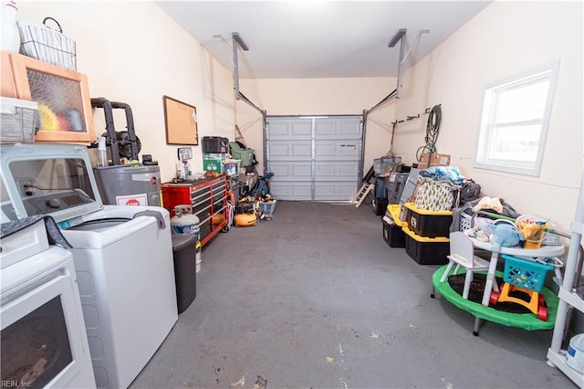 garage with independent washer and dryer and electric water heater